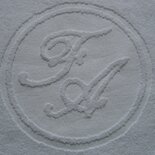 Tapetes de tela con logo tejido.